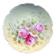 Assiette en porcelaine de Limoges à décor peint de fleurs