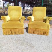 Pair of armchairs with golden velvet fringes