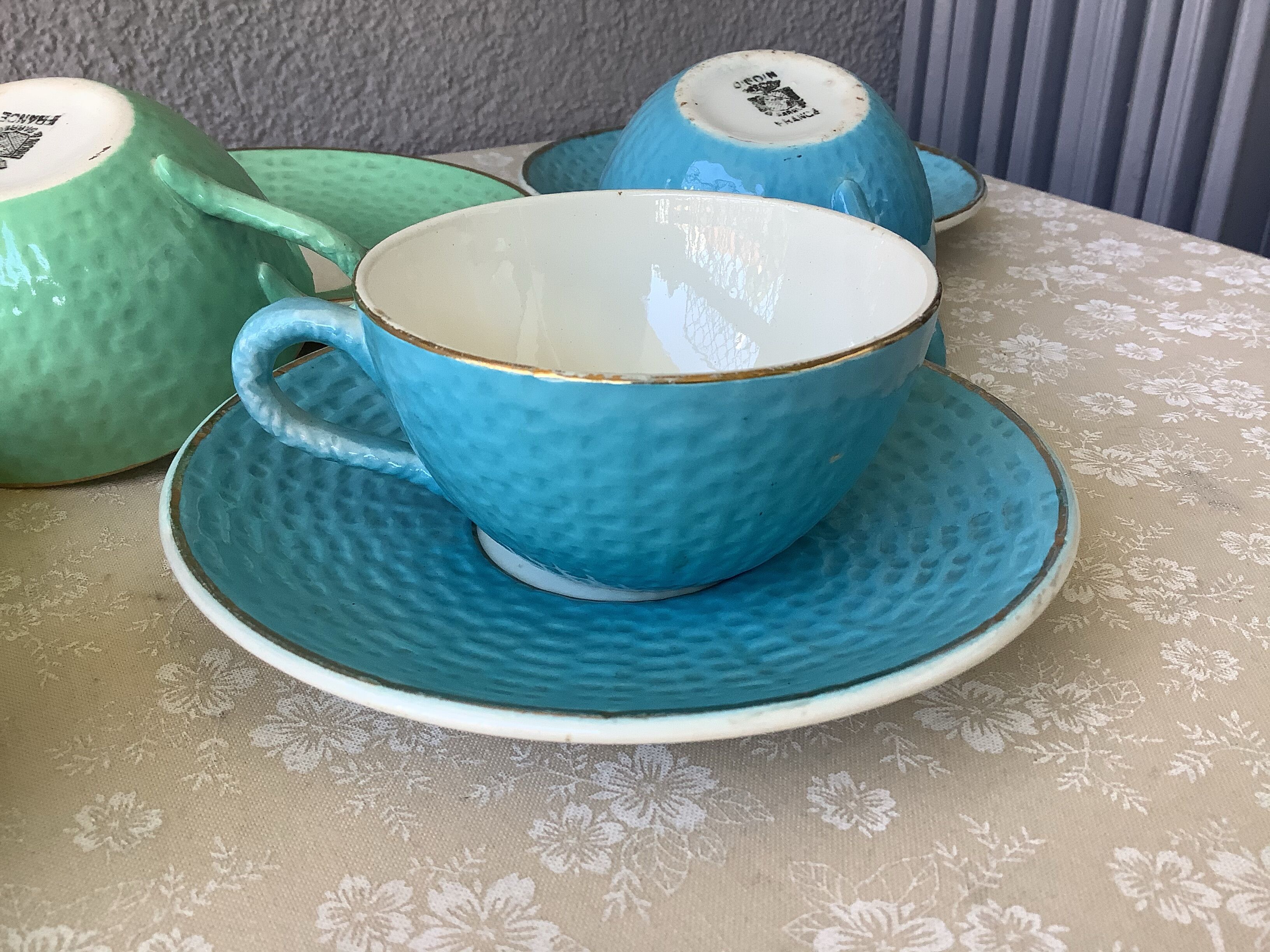 Multicolored Digoin cups looking basket weaving