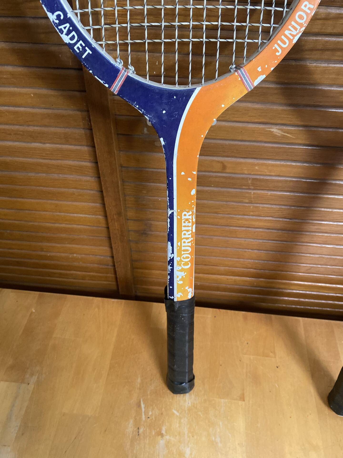 Pair of vintage wooden tennis rackets for cadet junior sport courier