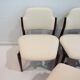 Set of six hardwood chairs by Arne Vodder for Sibast with white textile upholstery.