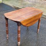 Louis Philippe round table with leaves, solid wood, 19th century, 95cm.