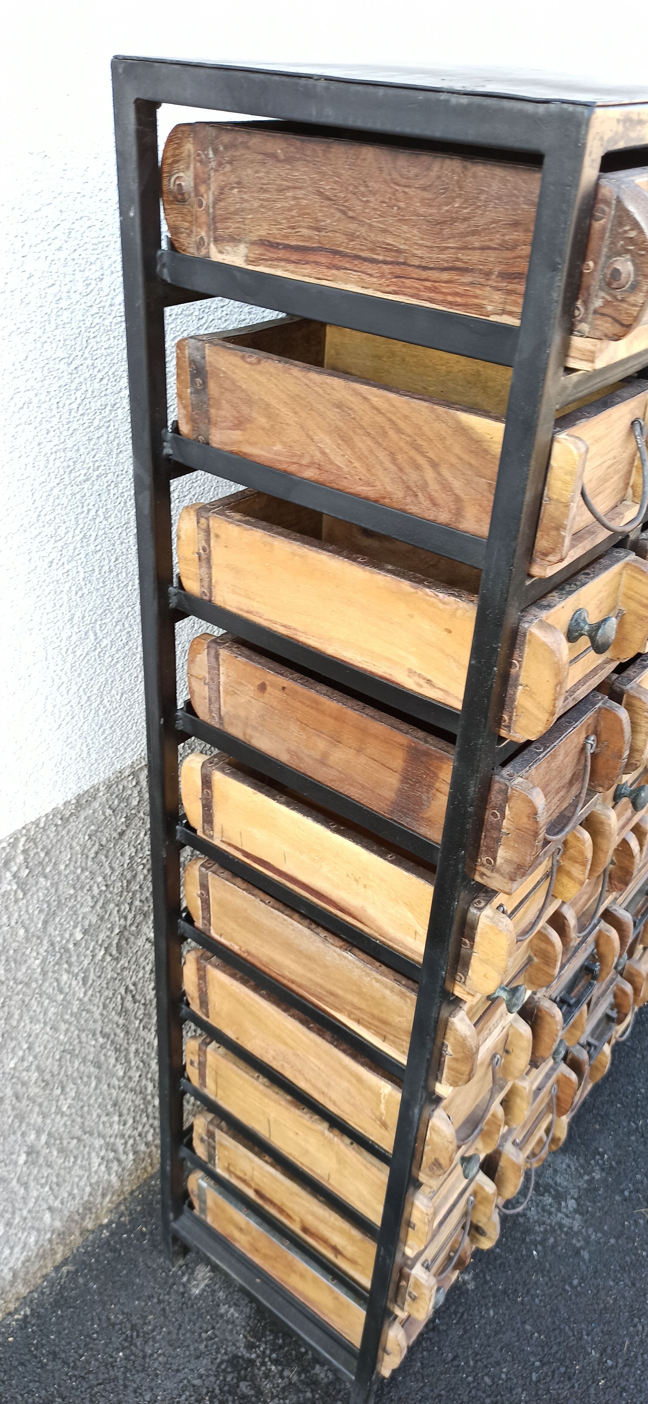 Black metal storage cabinet with 60 wooden drawers