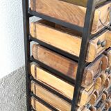 Black metal storage cabinet with 60 wooden drawers