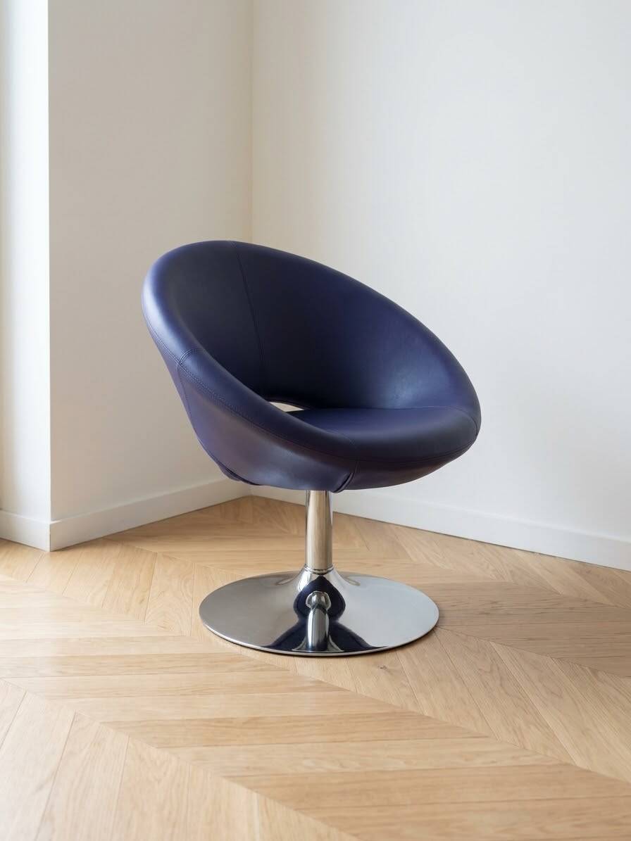 Vintage 70s armchair in purple faux leather with steel legs.