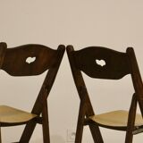 Pair of vintage folding chairs year 50 sculpted backrest.