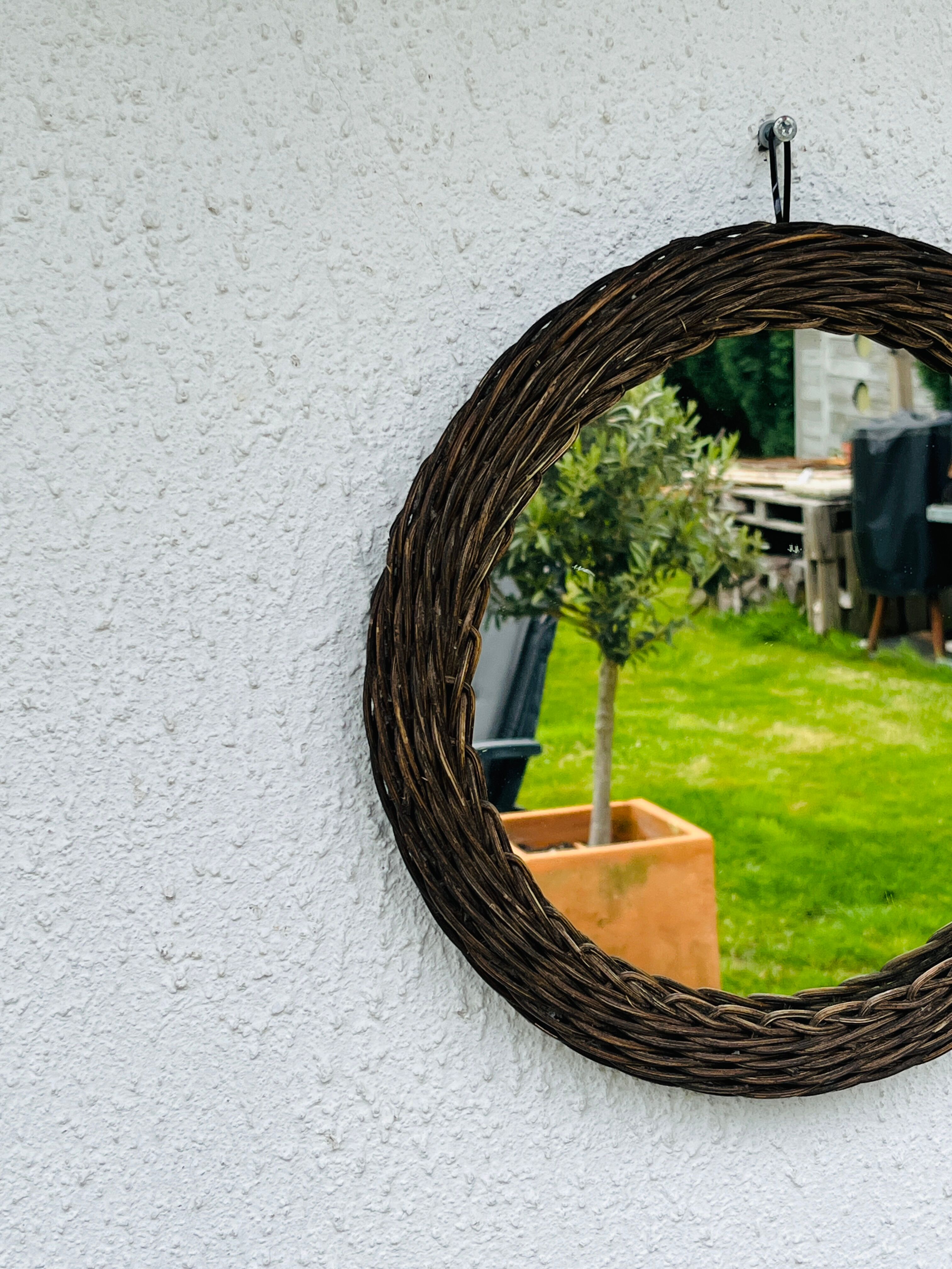 Vintage sun mirror in woven wicker