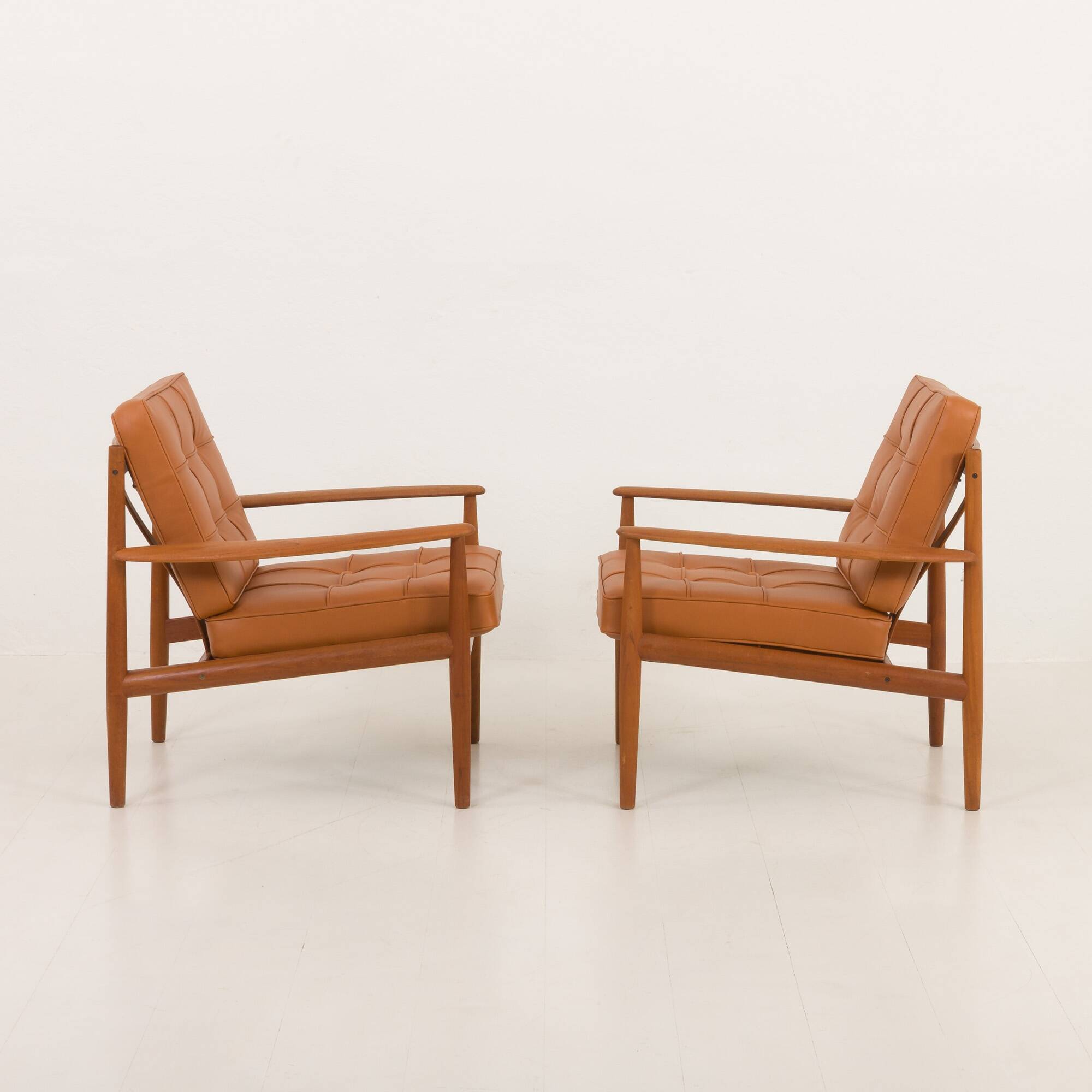 Rare Grete Jalk teak lounge chairs in aniline cognac leather for Cado