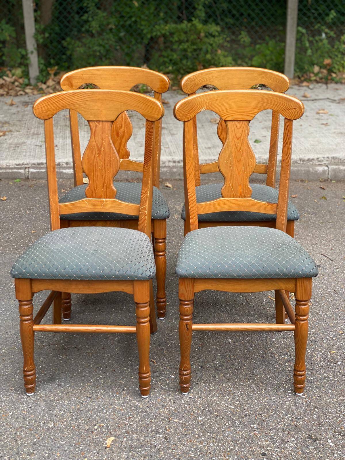 4 Landes chairs with solid wood frames and grey fabric.