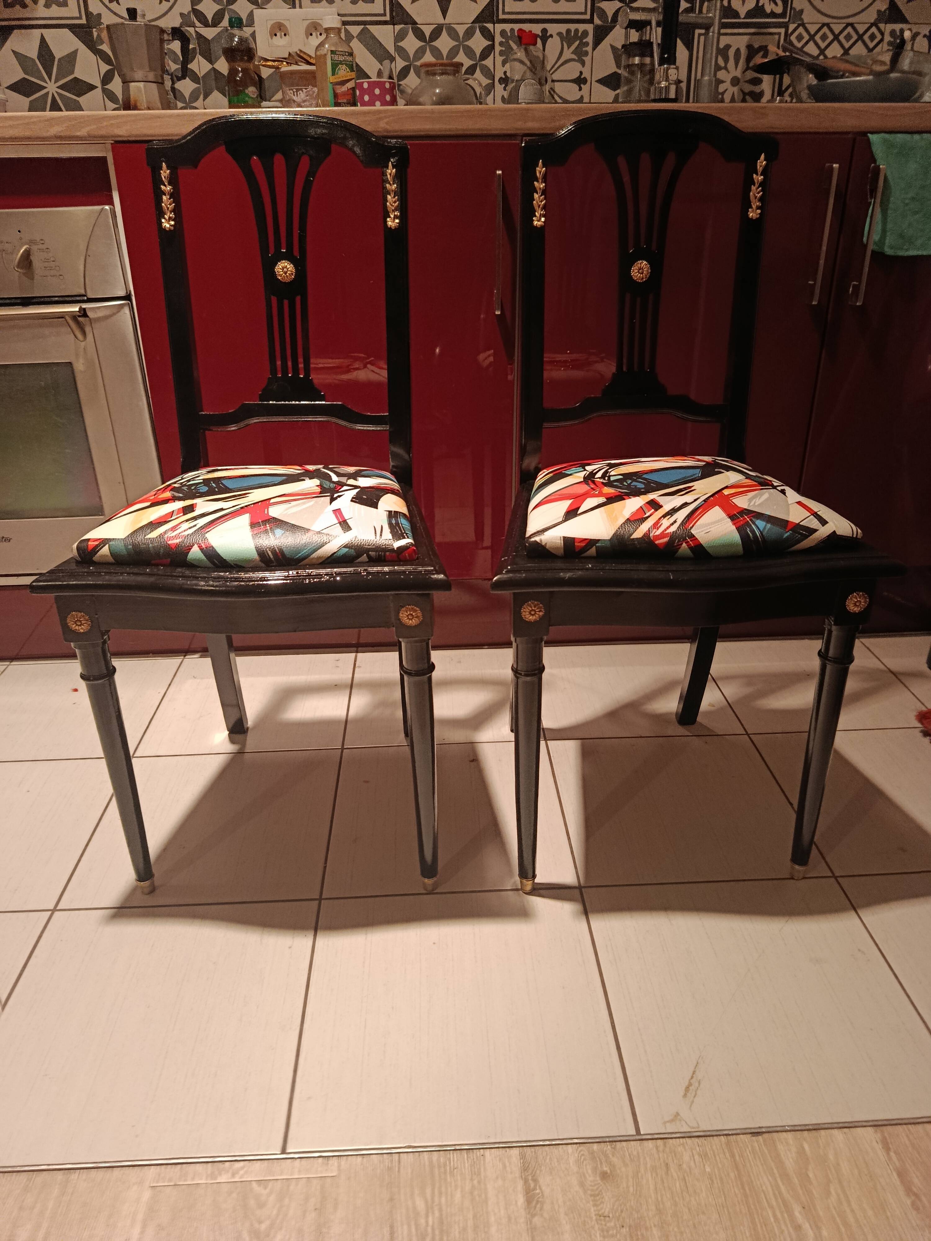 Pair of Hepplewhite neoclassical style chairs, relooked in black lacquer and faux leather.