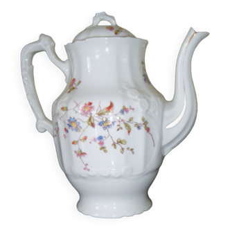 White porcelain teapot with small flowers