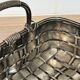 Woven silver-plated metal basket.
