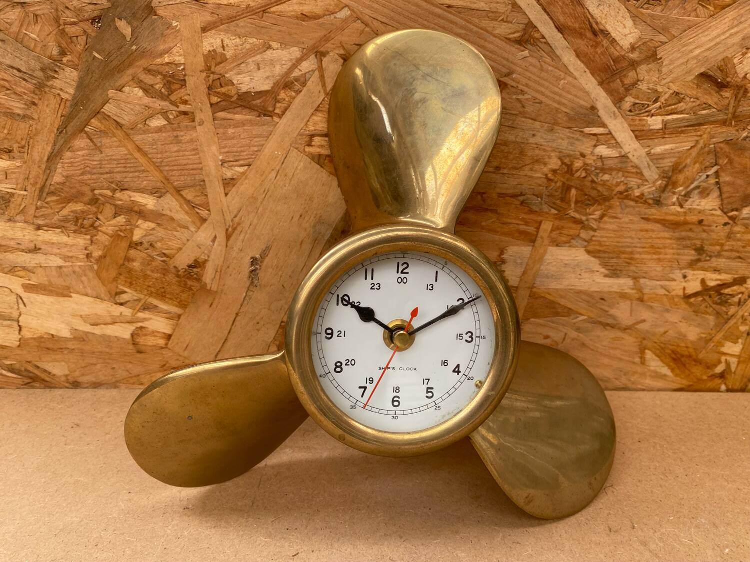 Antique brass propeller with pendulum vintage nautical wall clock