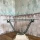 Glass and metal console with antique patina