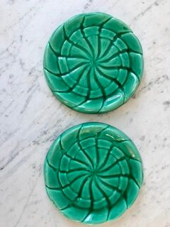 Duo of green slip bottle coasters signed marjac bauzil 50s
