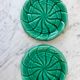 Duo of green slip bottle coasters signed marjac bauzil 50s