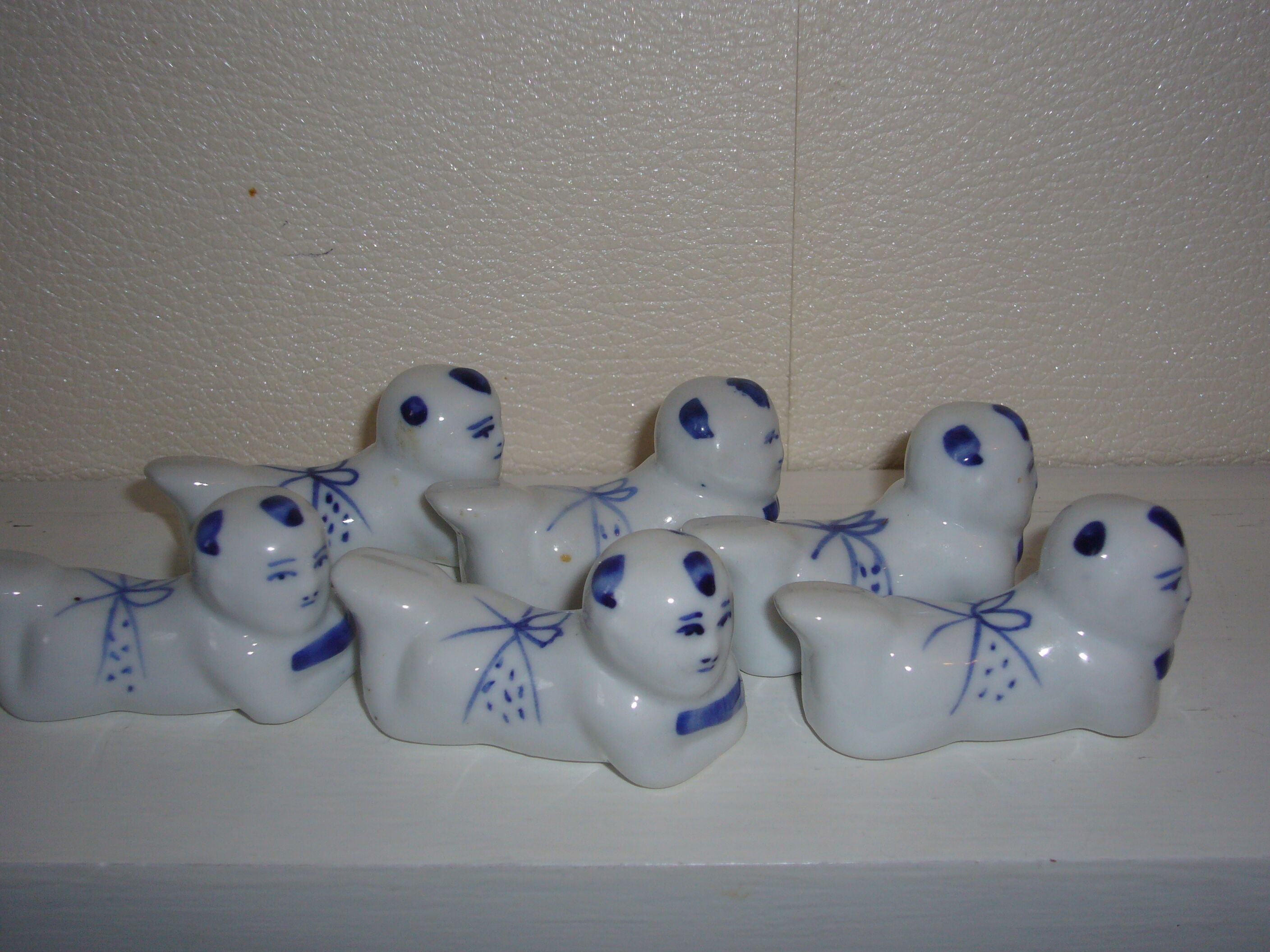 Wears vintage porcelain knives