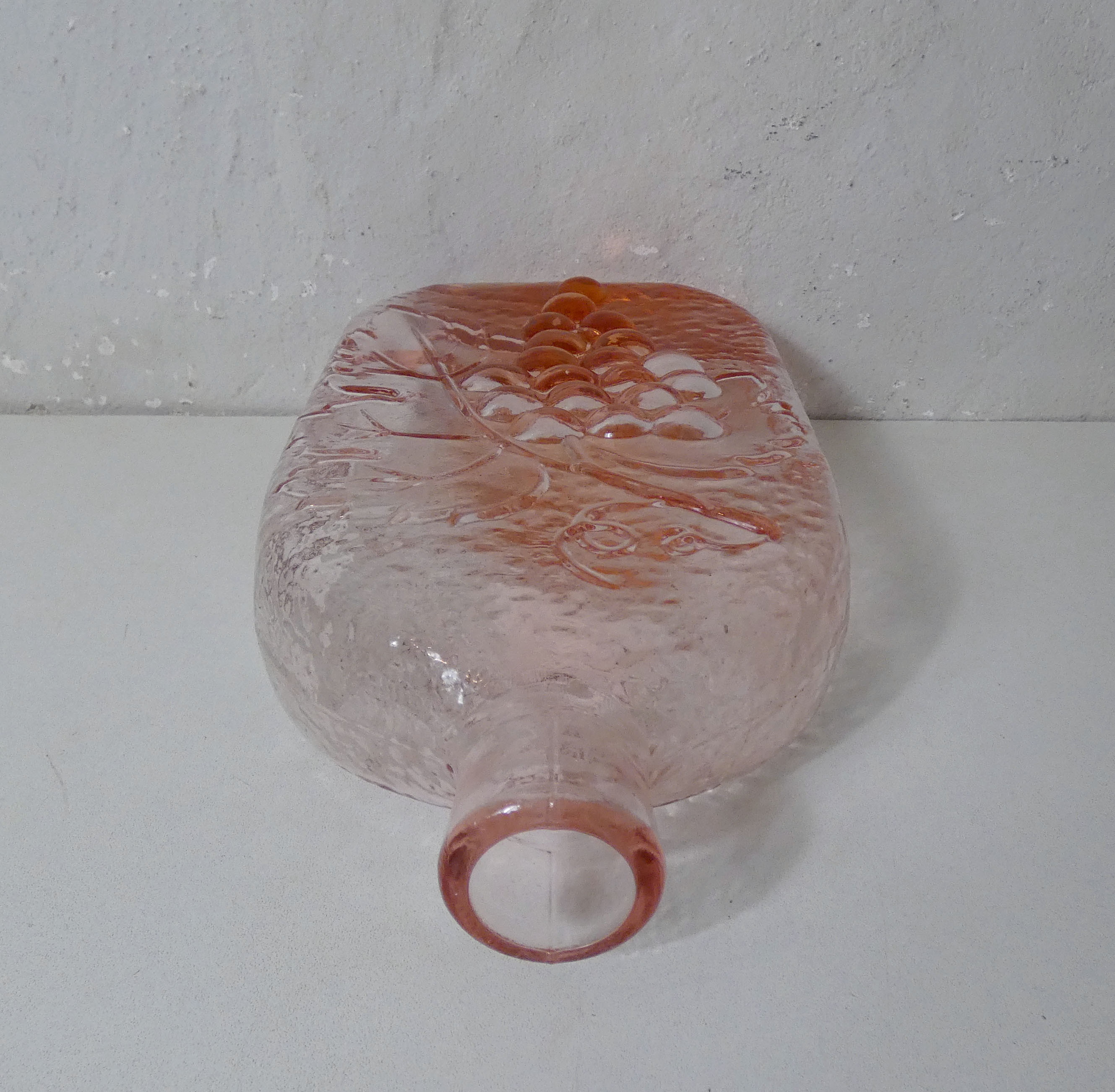 old carafe in orange pink glass