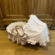 1960s wicker cradle with mattress and drapes.