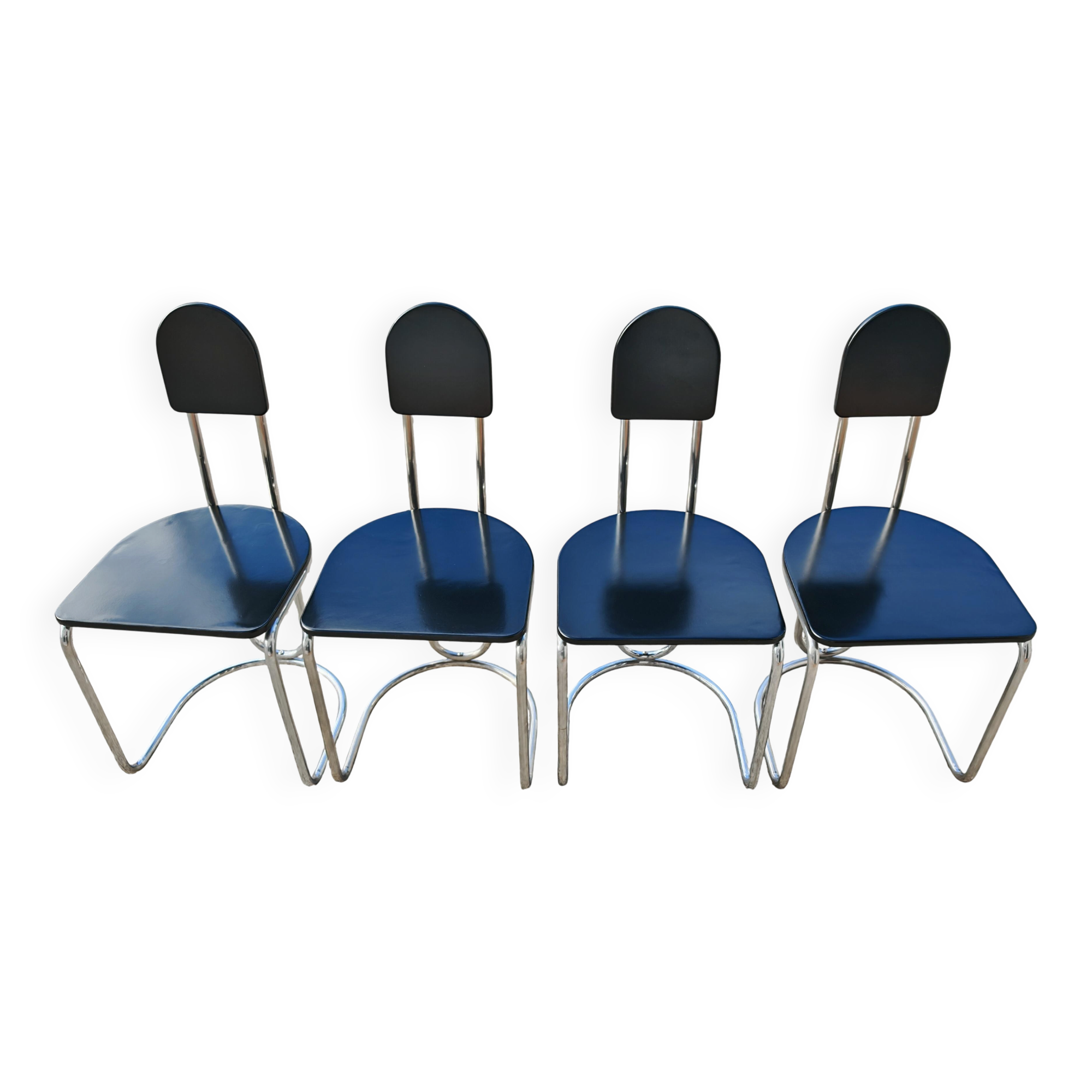 Set of 4 Bauhaus tubular steel chairs with wooden seats.