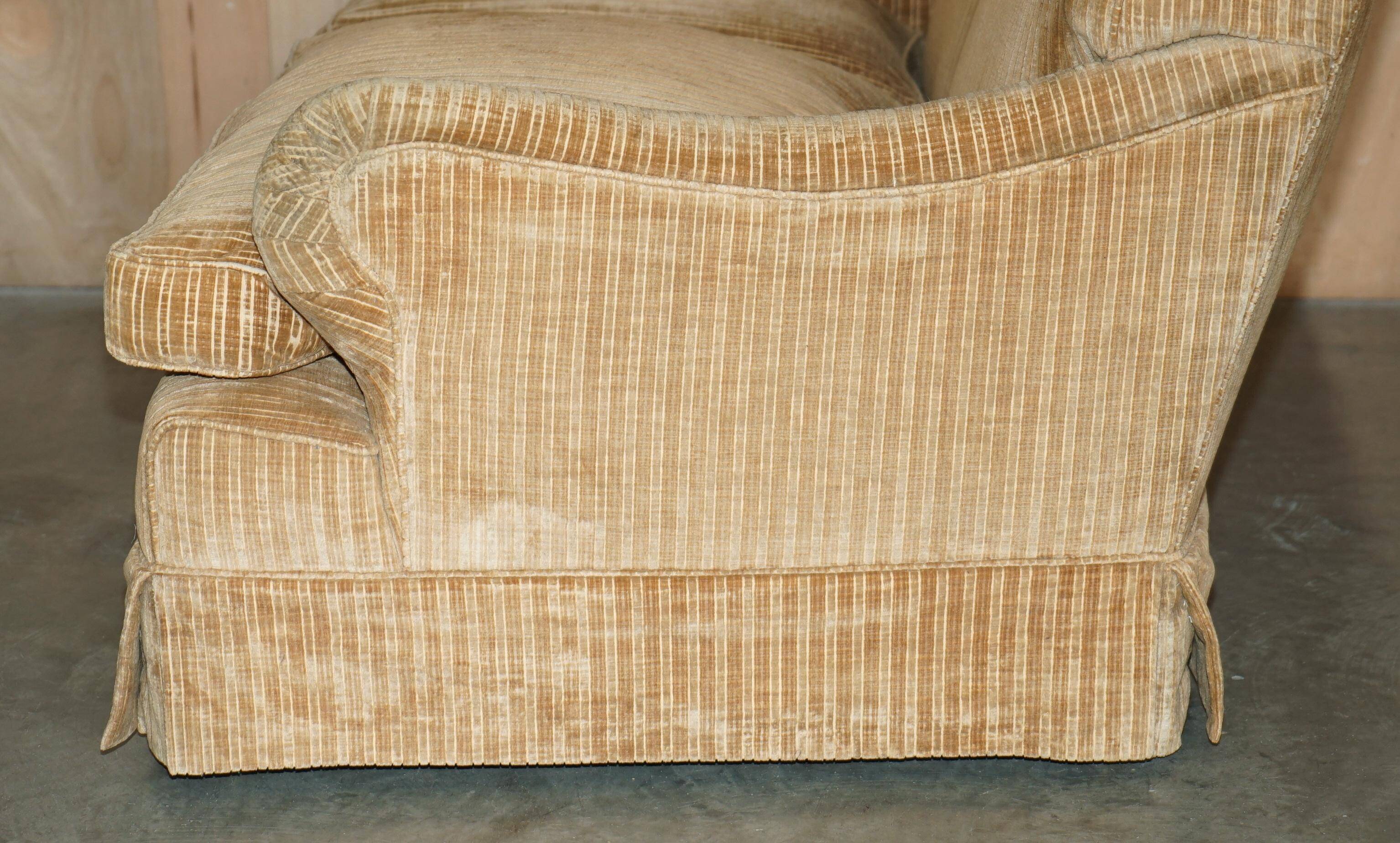 Howard & Sons / Chairs Ltd two-seater canapé with feather-filled cushions.