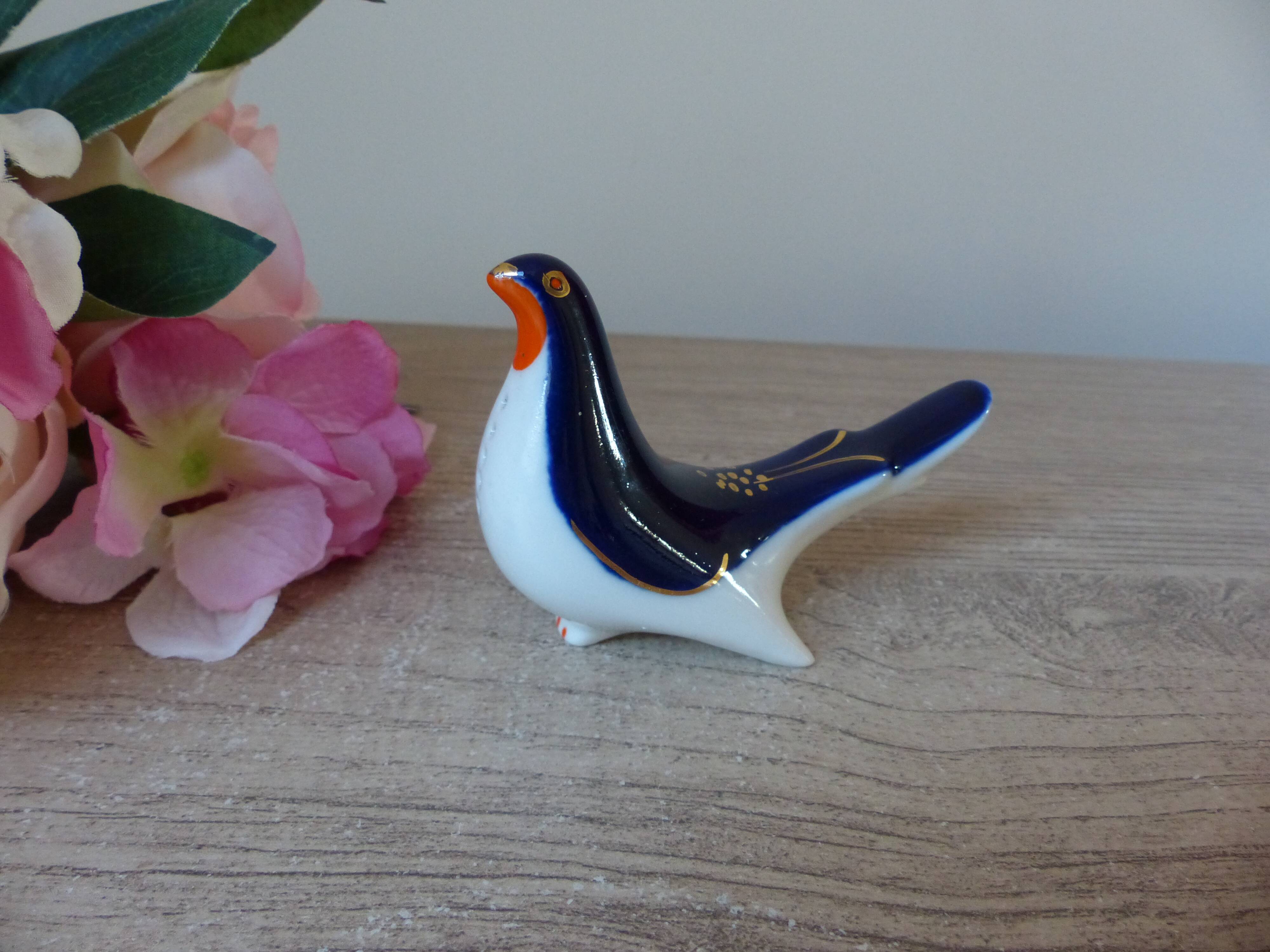 Vintage Soviet salt and pepper shaker in the shape of a cobalt blue bird.