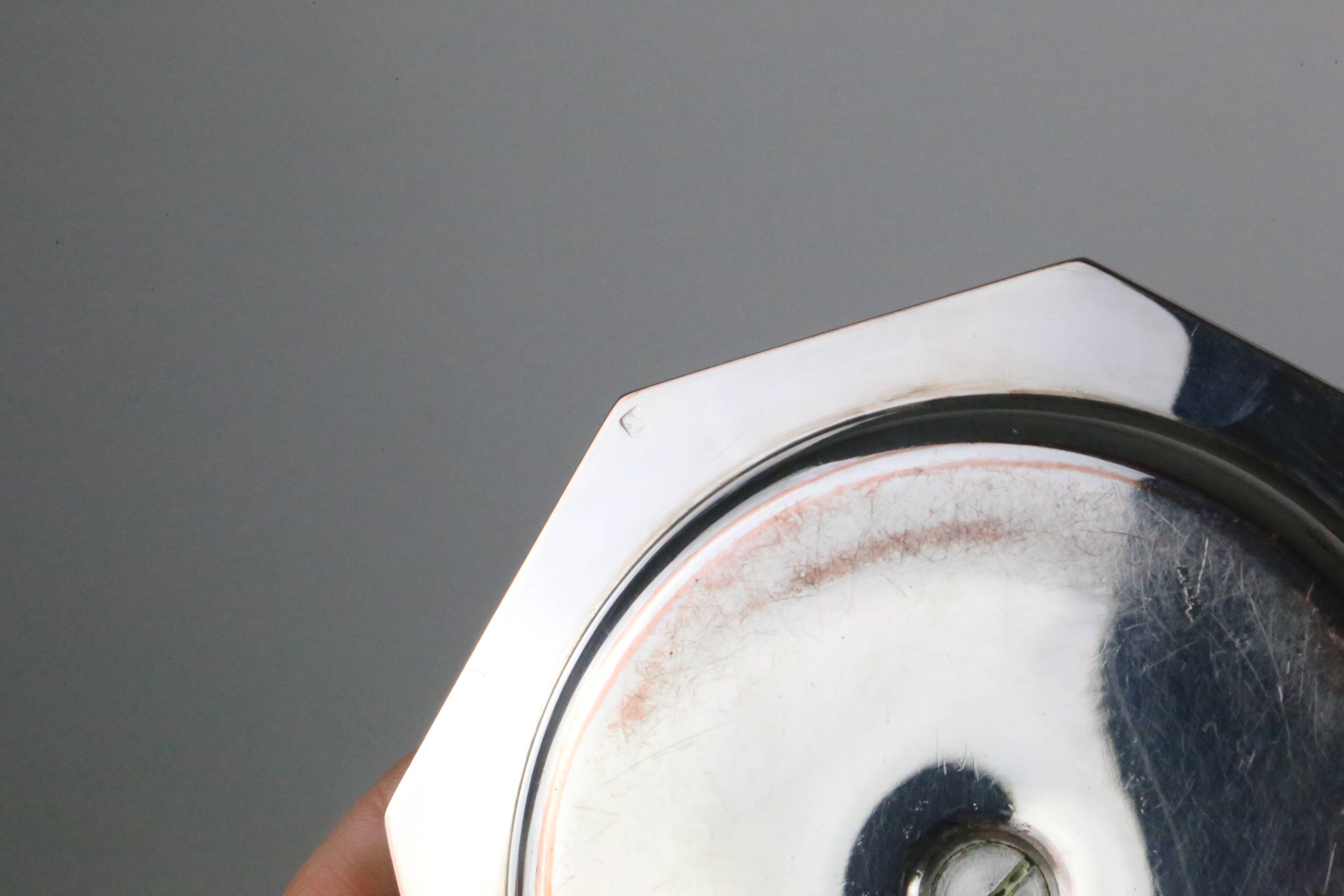 Pair of silver-plated metal candlesticks