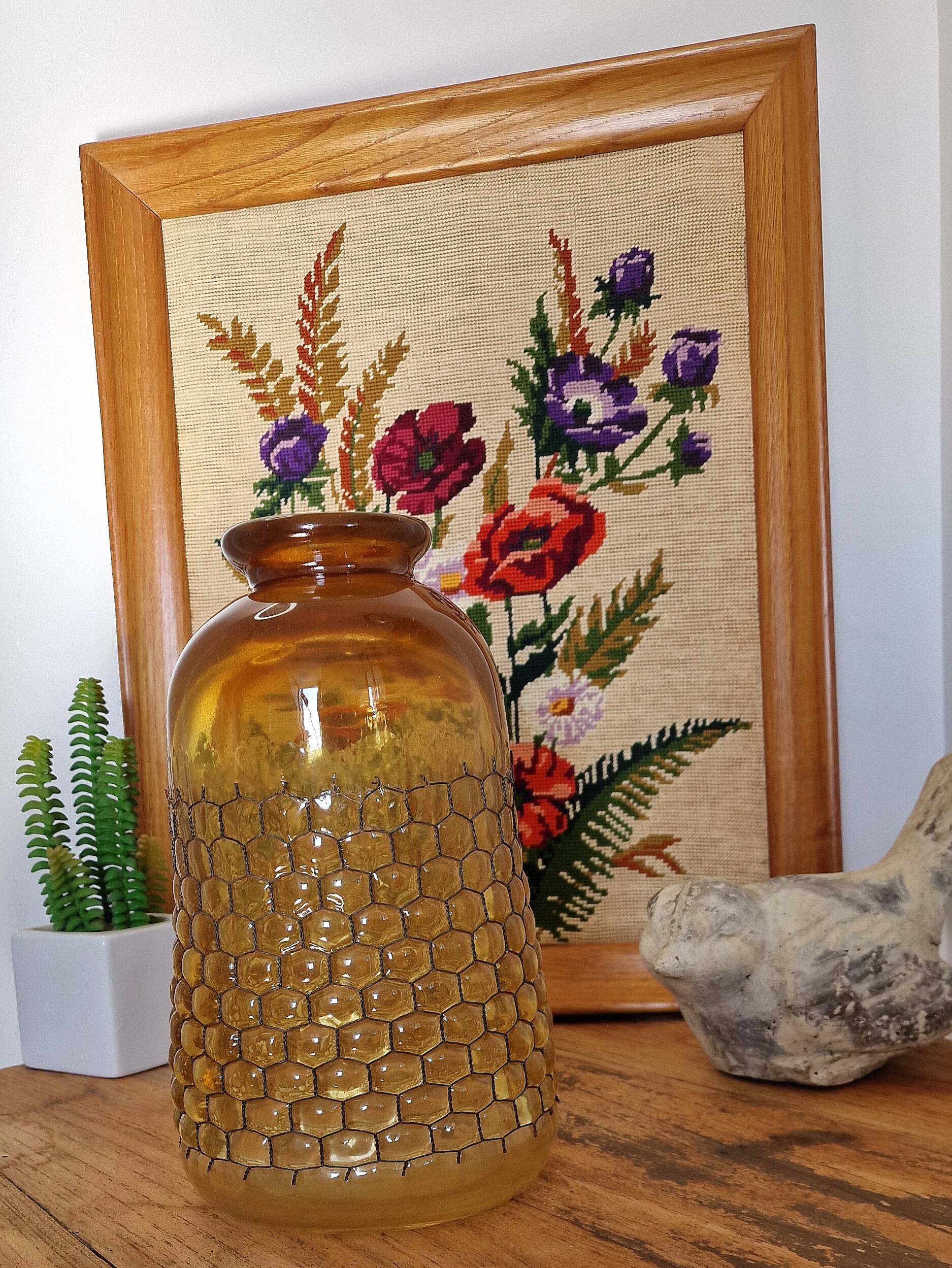 Artisanal blown amber glass vase with integrated honeycomb structure.