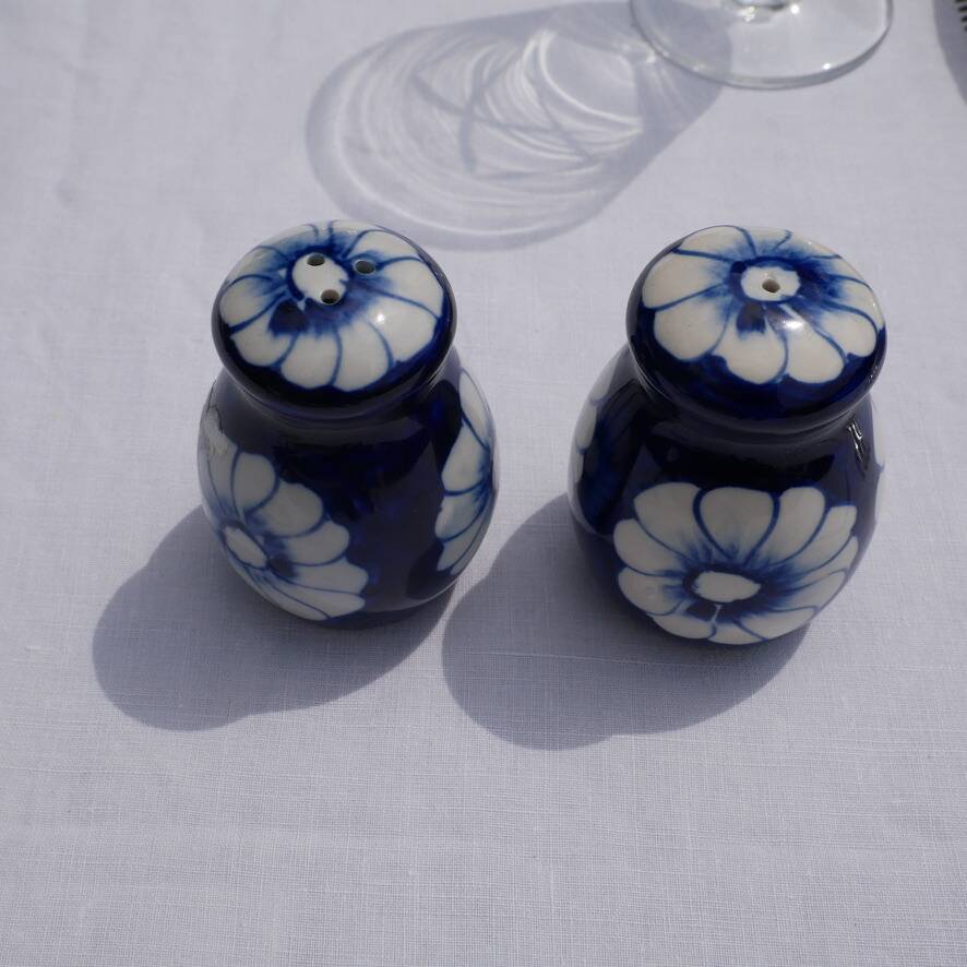 Blue ceramic salt and pepper shaker with flower pattern