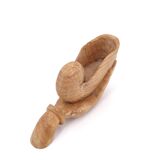 Wooden hand emptier holding a shell, 1970s