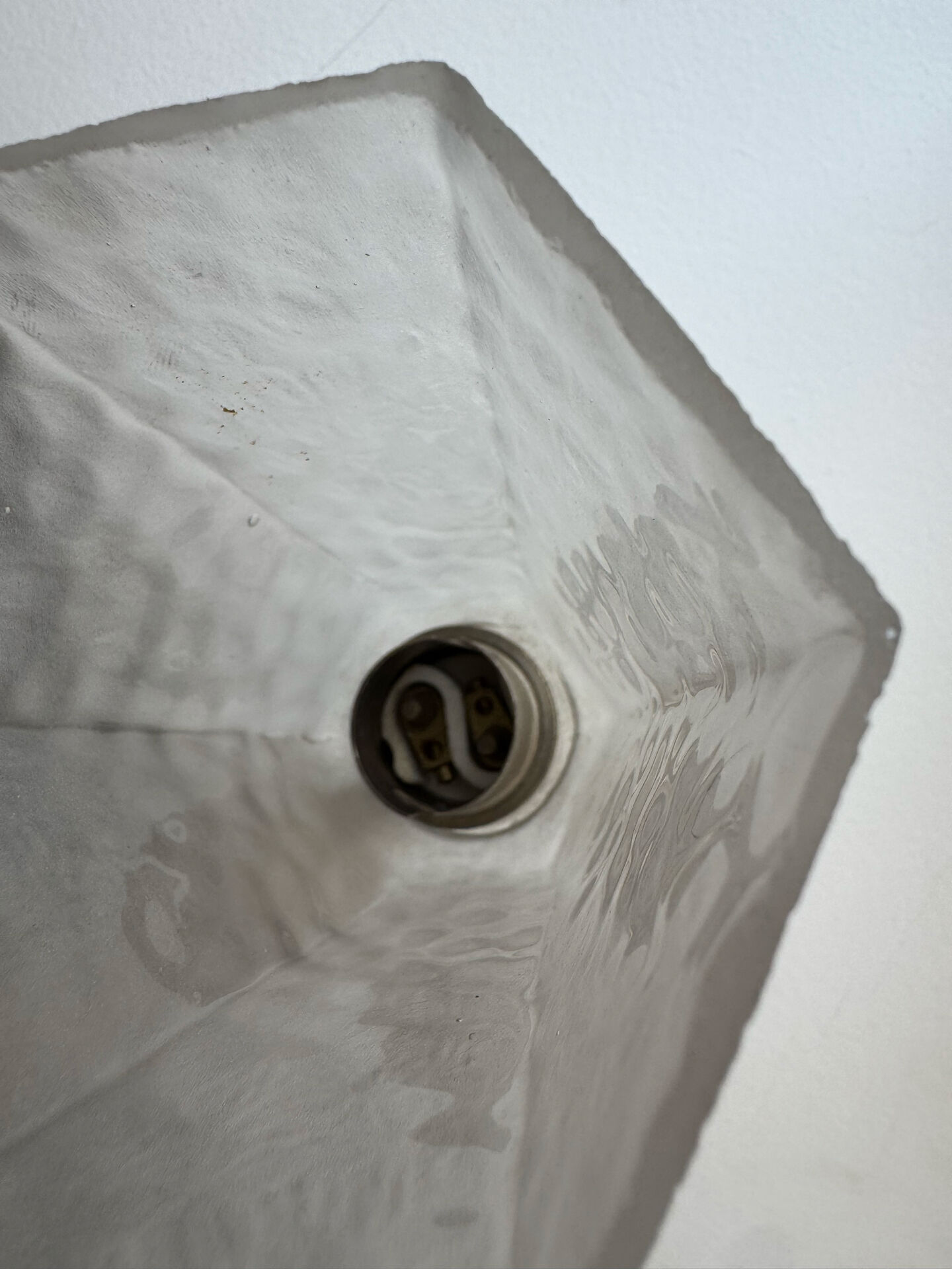 Silver Art Deco wall lights with frosted glass.