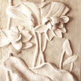 Bas-relief with flowers. Relief with flowers. Flowers in relief.