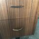Mid-century hairdresser in brown teak and white with a mirror and brass legs.