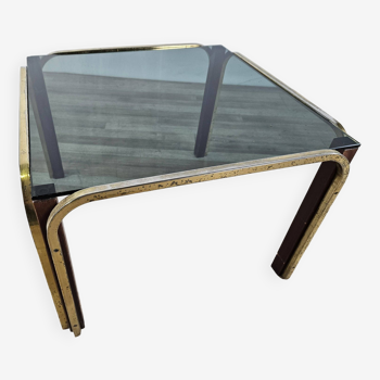 Coffee table in golden metal and smoked glass