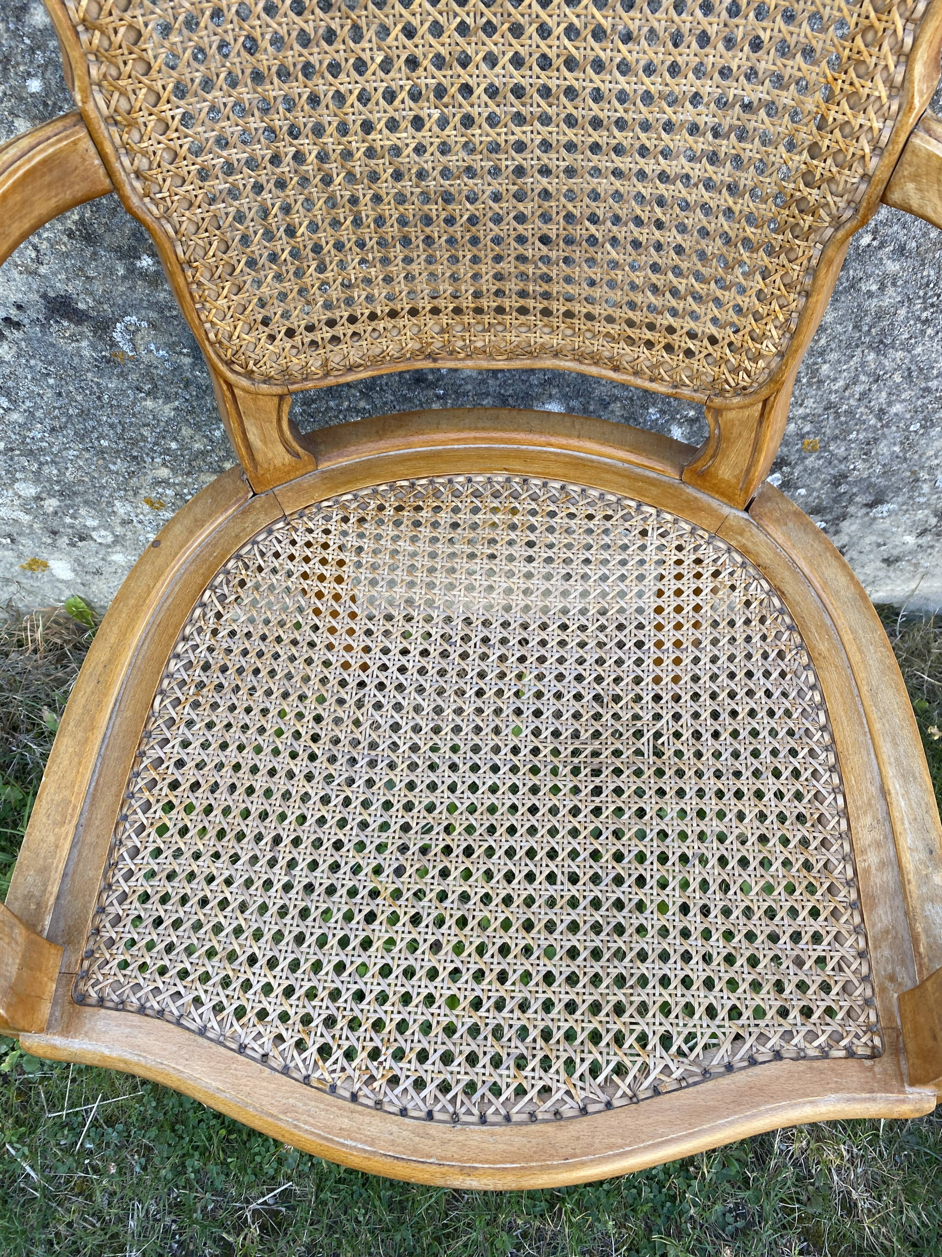 Cane armchair