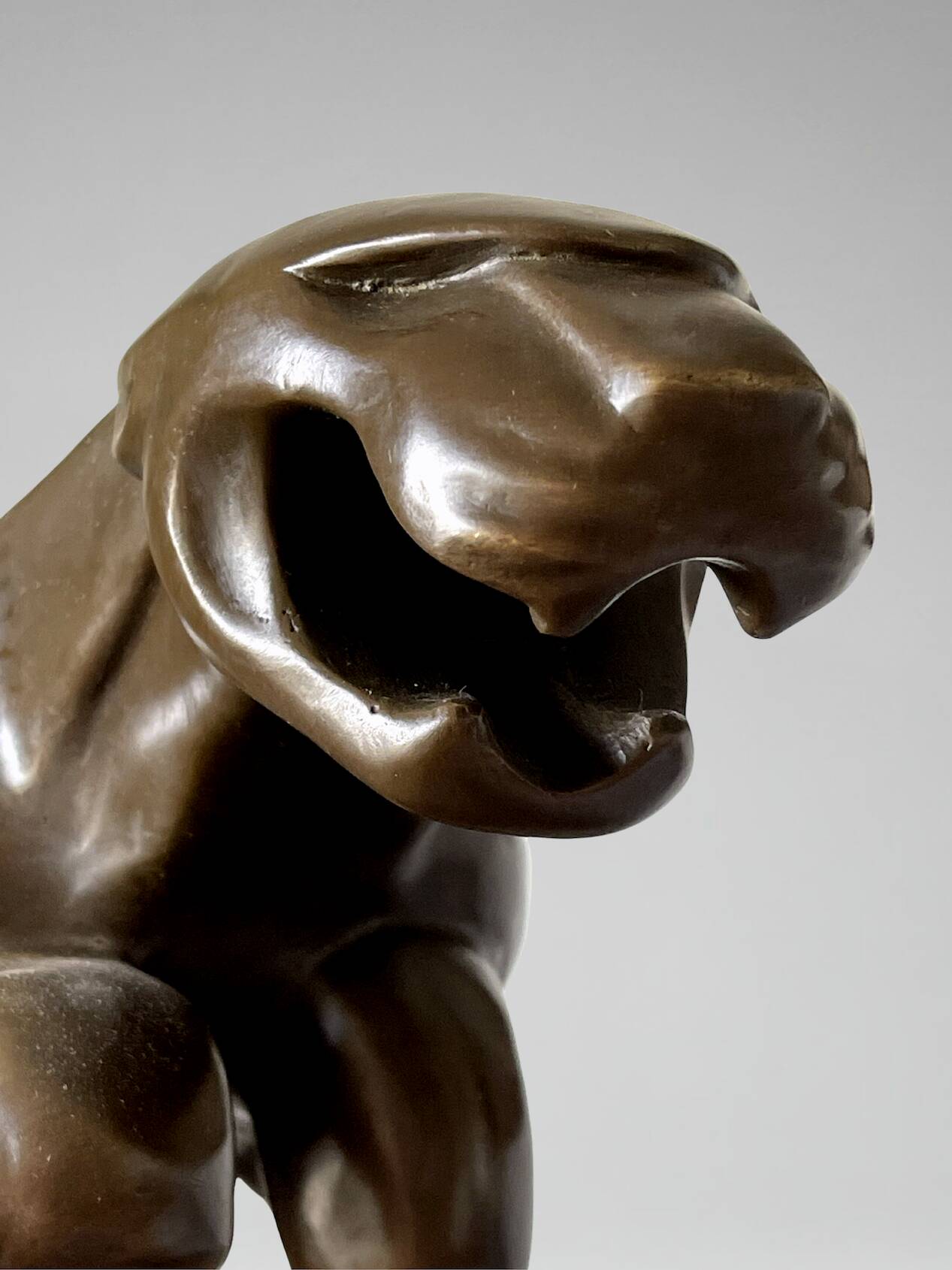 Large Art Deco bronze patinated Jaguar sculpture on an architectural base.