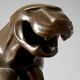 Large Art Deco bronze patinated Jaguar sculpture on an architectural base.
