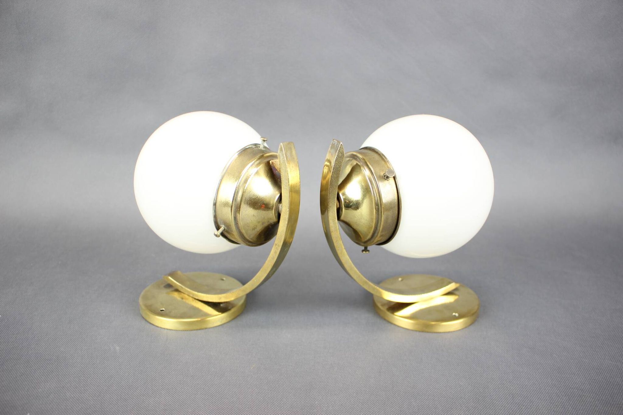 Pair of Art Deco wall sconces in brass and opaline glass, Europe, 1930s