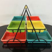 Black metal appetizer set with colorful ceramic ramekins
