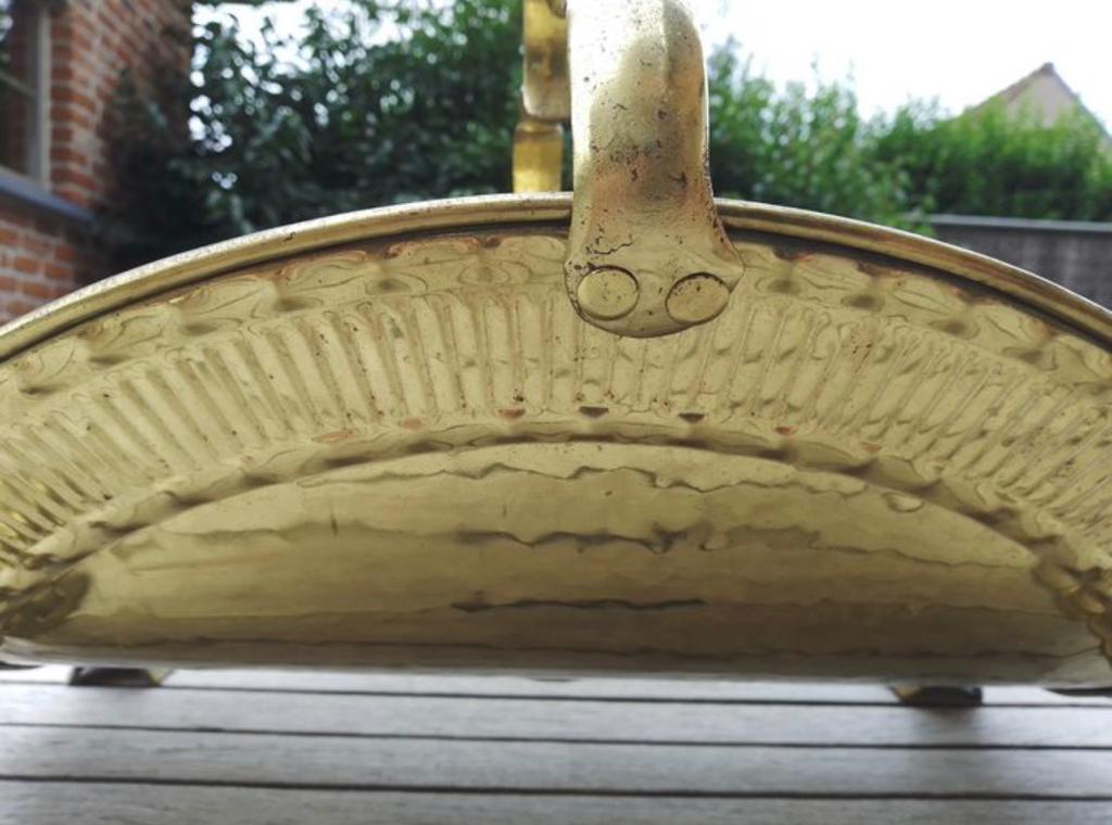 Old brass log holder