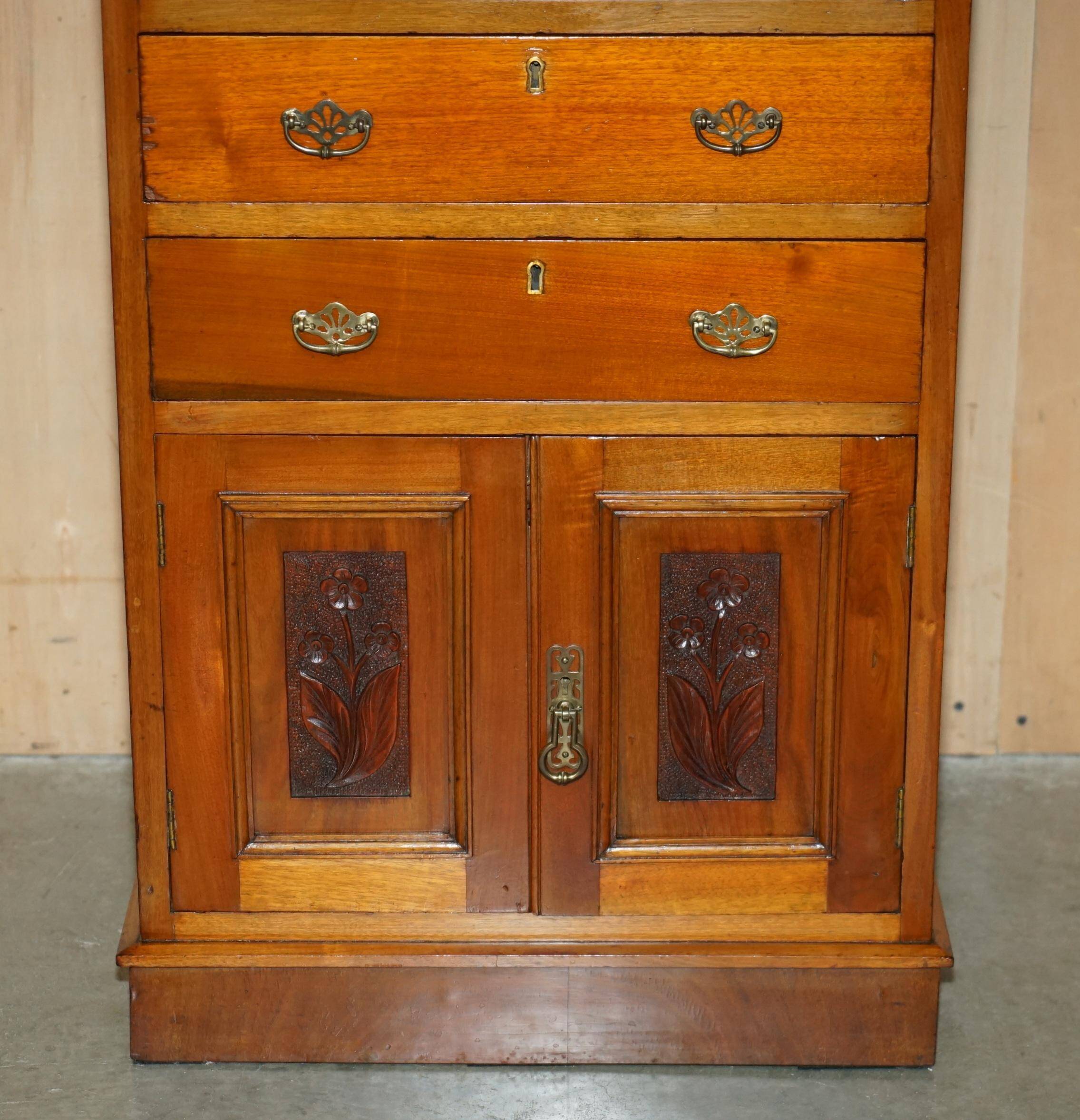 Victorian high chest of drawers in walnut with a bronze gallery.