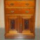 Victorian high chest of drawers in walnut with a bronze gallery.