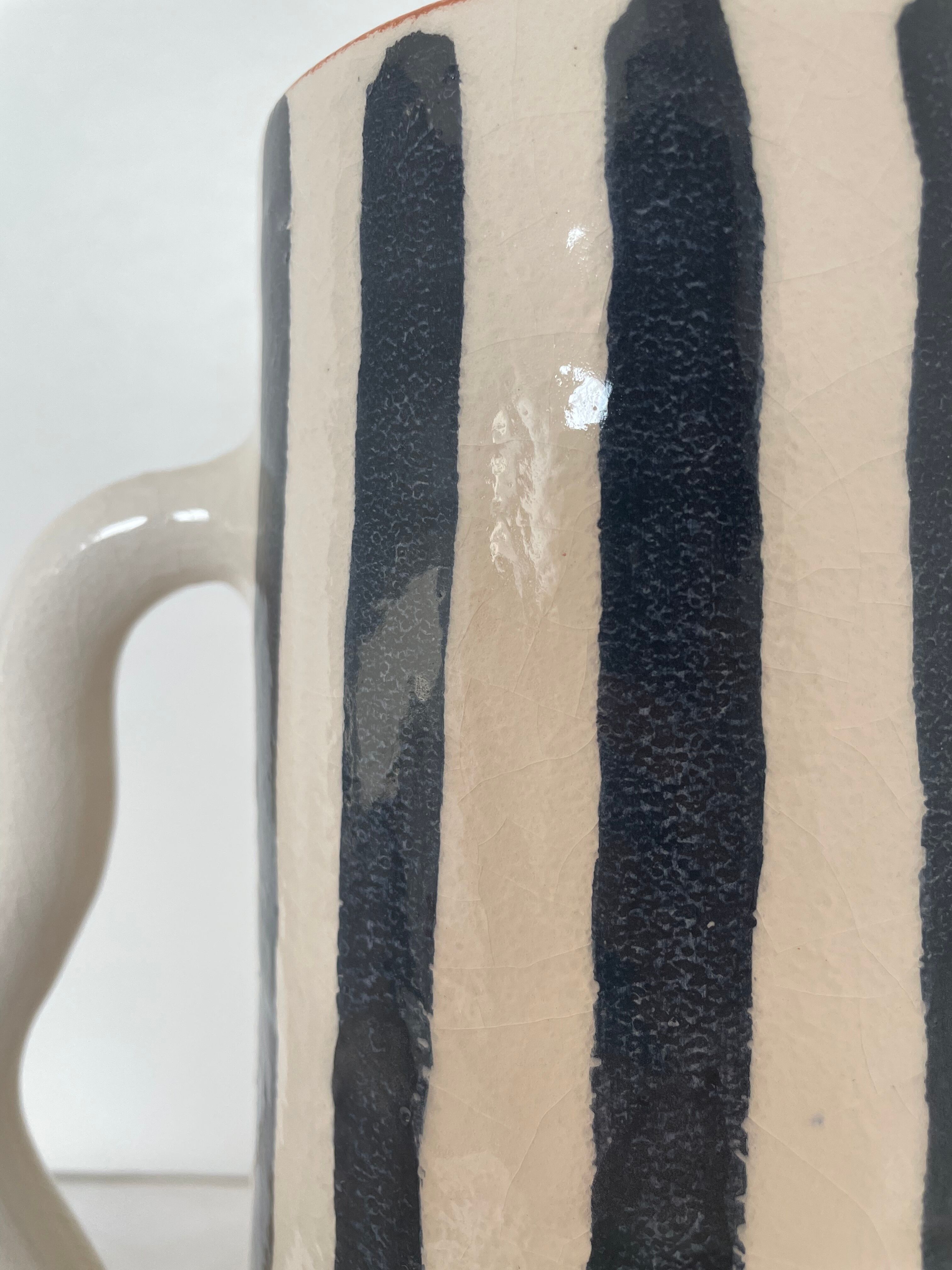Blue-grey striped ceramic vase with abstract handmade wavy handheld