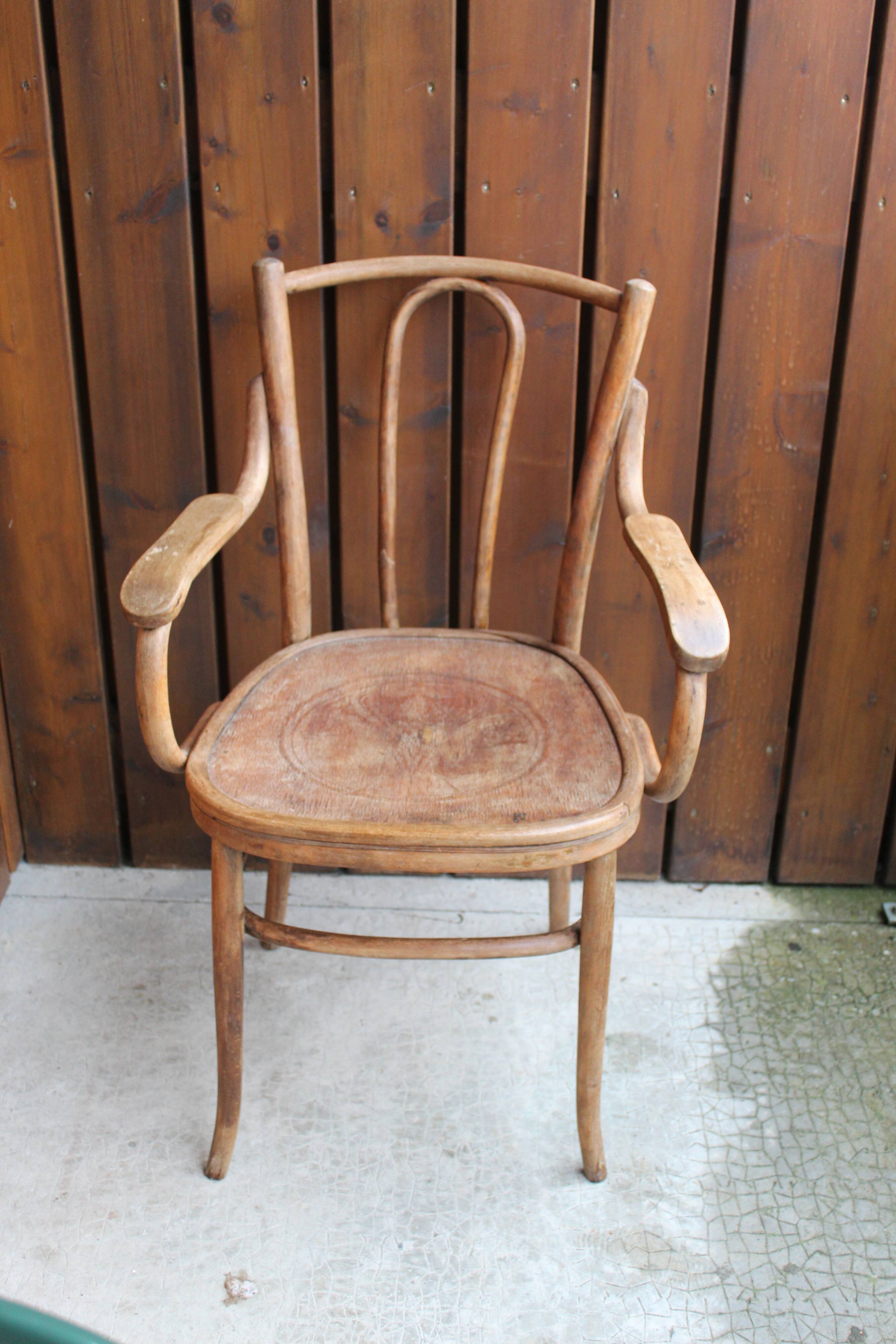 Curved wooden armchair