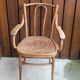 Curved wooden armchair