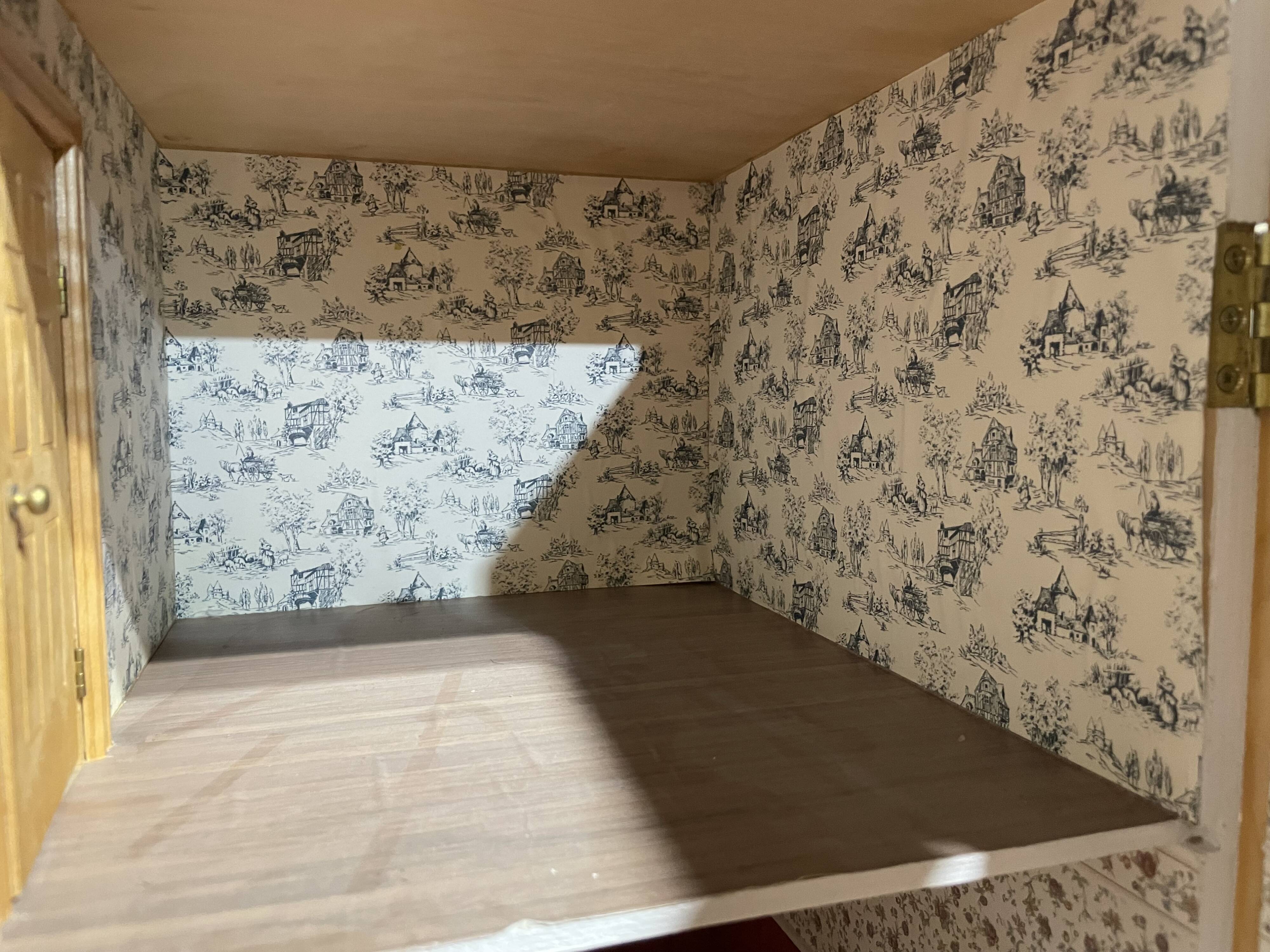 Large wooden dollhouse with miniature furniture
