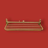 Vintage wall-mounted coat rack in anodised gold aluminium with hat holder.