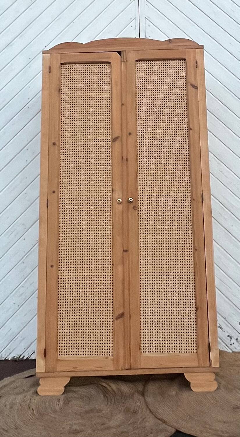 Renovated antique wardrobe in raw wood and caning.
