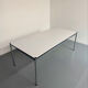 Large table design USM Haller with a white top and chrome structure.