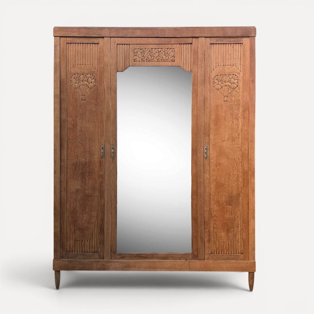 Art deco wardrobe in raw oak with bevelled mirror.